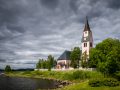The church in Arjeplog, Sweden under a dramatic dark sky.